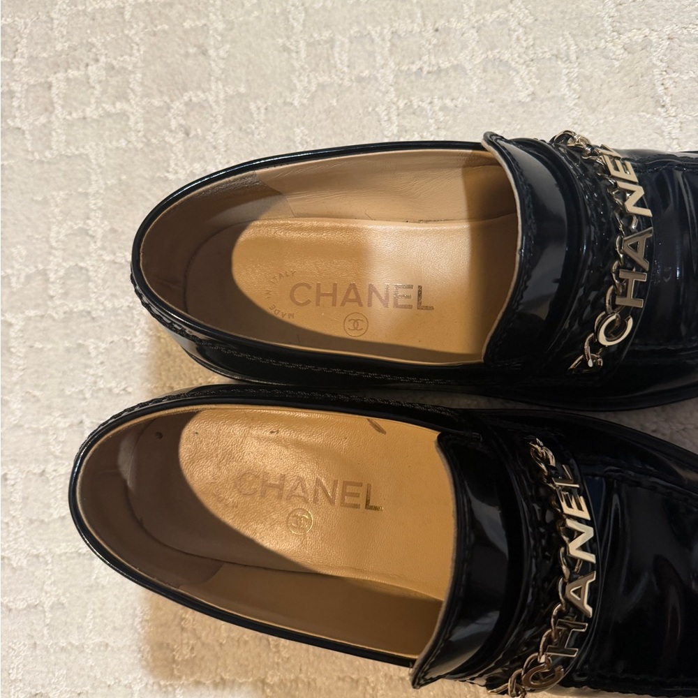 CHANEL Glossy Black Loafers with Gold Accents - Picture 2 of 5